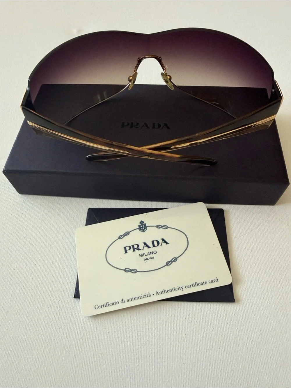 Prada Brown Gradient Rimless Sunglasses with Gold Accents